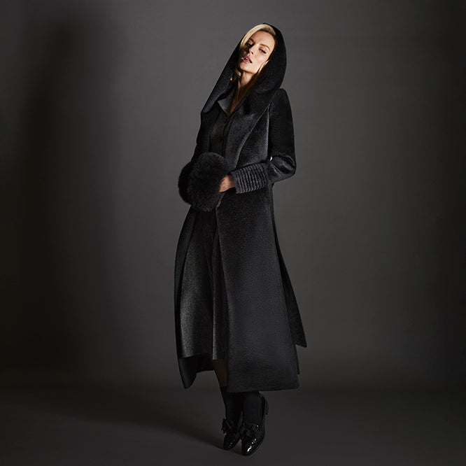 Sentaler Suri Alpaca Maxi Hooded Wrap Black Coat in Suri Alpaca wool. Seen from side open with hood on female model.